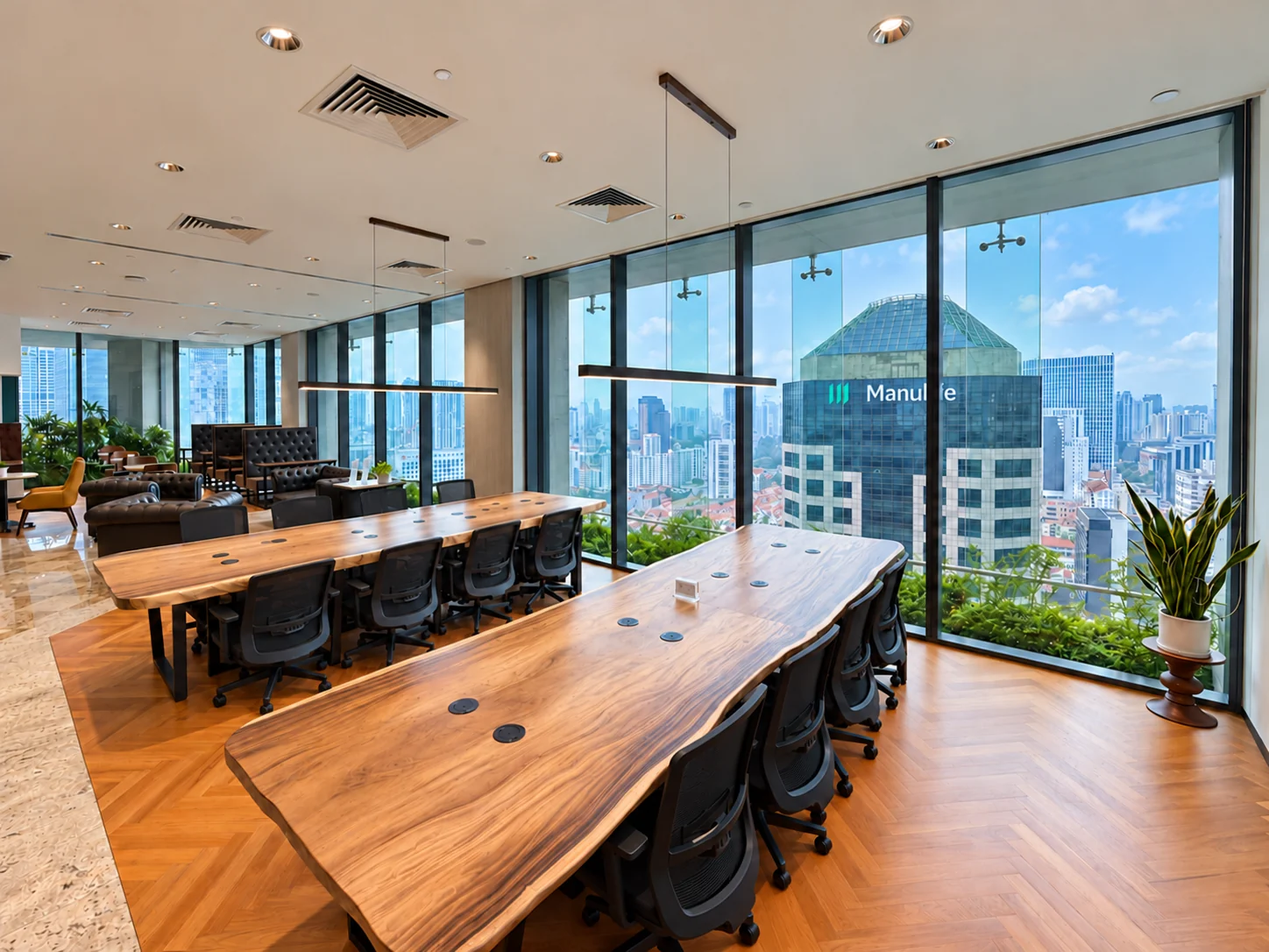 Shared work tables with city views at CapitaGreen Level 24