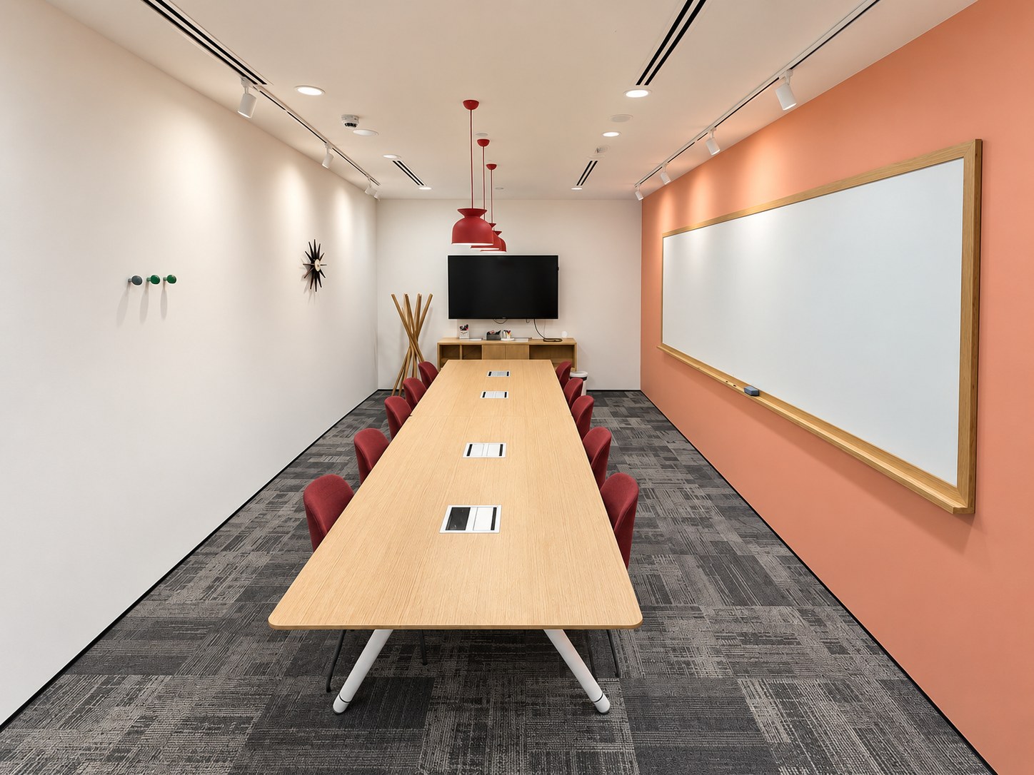 Bright meeting room with conference table and whiteboard at Spaces, Paya Lebar Quarter 1